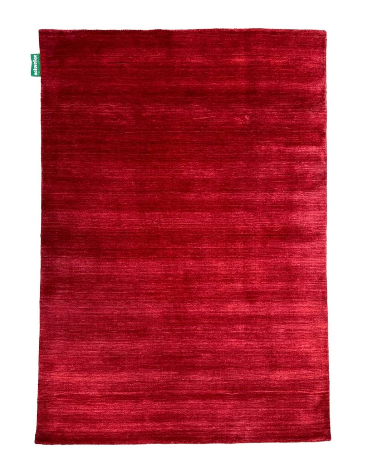 GABBEH PLAIN GAIA als zentrales Design-Element eines Wohnraumes.